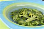 Healthy broccoli soup in a blue plate