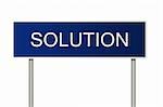 A blue road sign with white text saying Solution