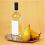 Still life from a bottle of pear wine on the table