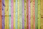 Wooden wall painted in the colors of the rainbow