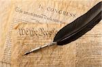 The Constitution for the United States of America with a quill pen