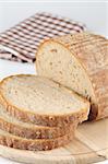 Loaf of fresh bread on cutting board