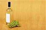 The open arrangement of bottle of white wine on a wooden background