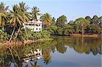 Waterfront villa at at the edge of a scenic tropical lake