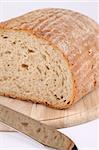 Loaf of fresh bread on cutting board