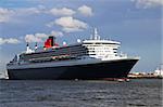 Cruise ship Queen Mary 2 sailing on the river when leaving Port of Rotterdam