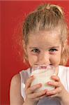 happy little girl drinking milk