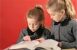 Two little girls studying together