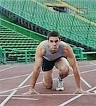 young healthy man run on athletics race sport track and representing concept of sport and speed