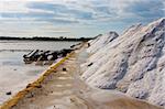 Salt Pile in a Salt Mine next to Trapani, Sicily with a cloudy sky at the morning