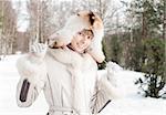 winter portrait of young and beautiful natural looking woman in casual clothes with her eyes closed