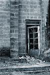 Ruin of old wall and windows and door.