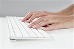 woman hands typing keyboard on desktop