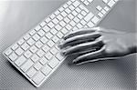 computer keyboard aluminum gray hand silver background