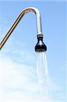 shower sprinkler on blue sky outdoor water falling