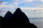 The famous Pitons of Saint Lucia silhouetted against the sky.