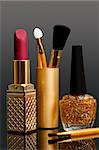 lipstick; enamel and cosmetic brushes
