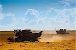 Harvest time / A combine harvester working in a  field