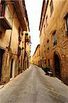 Narrow Alley With Old Buildings In Typical Italian Medieval Town