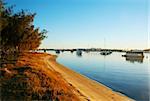 Houseboats and yachts moored in the Broadwater Gold Coast Australia on a golden morning.