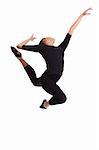Ballerina in a black suit in the air (jump). Isolation on a white background in the studio.