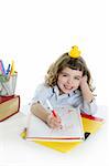 little girl happy student on desk writing and smiling
