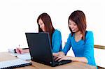 Two Asian female student studying and using computer