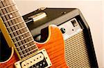 close up of electric guitar and amplifier isolated on white background