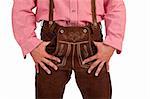 Closeup of a Bavarian man with hands in oktoberfest leather trousers (lederhose) pocket.