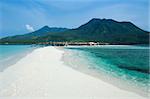 white beach overlooked by volcanos on camiguin island near mindanao in the philippines