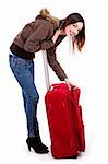 young lady posing while unzipping her travel bag
