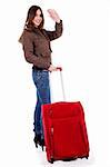 young woman waving hand holdin luggage