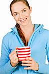 Portrait of a beautiful young smiling woman holding a cup of coffee or tea. Isolated over white.