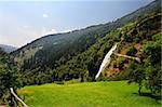 Big Waterfall With Rapids In The Italian Alps