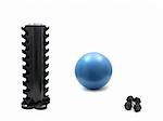 A fitball, dumbells and an empty dumbell rack isolated against a white background