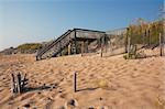 Wooden stairs over a sand dune to a beach near Nags Head on the Outer Banks of North Carolina