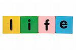 toy letters that spell life against a white background with clipping path