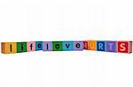 toy letters that spell life love hurts against a white background with clipping path