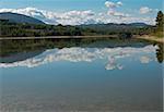 Peaceful lake landscape, the sky reflecting on its surface