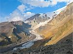 Glacier flowing down from the mountain.