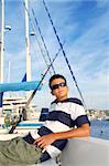 boy relaxed teenager on sea boat marina sunglasses summer vacation