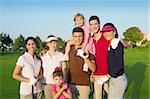 Golf course group of friends people with children posing standing