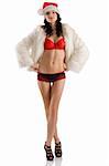 young sexy brunette in red and black lingerie black shoes wearing white fur and a christmas hat posing on white