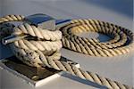 Rope neatly rolled up on the deck of a  boat