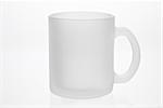 Empty white mug isolated on a white background. Matte glass.