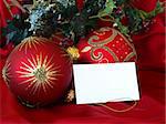 red christmas ornaments and seasonal greeting card