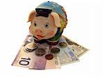 Funny piggy bank on the dollar banknotes, isolated object