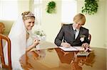 Solemn registration - the wedding ceremony. The bride and groom at the table