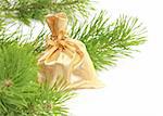 Christmas ornaments and branch of a pine. Isolated over white
