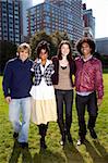 A group of college students in a park - shot against the sun with solar flare